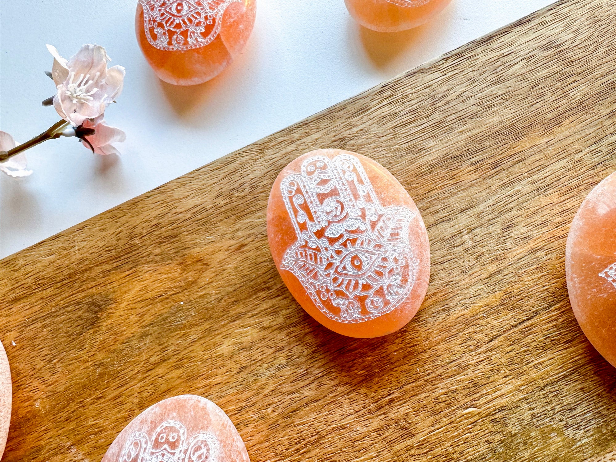 Peach Selenite Engraved Hamsa Palm Stone