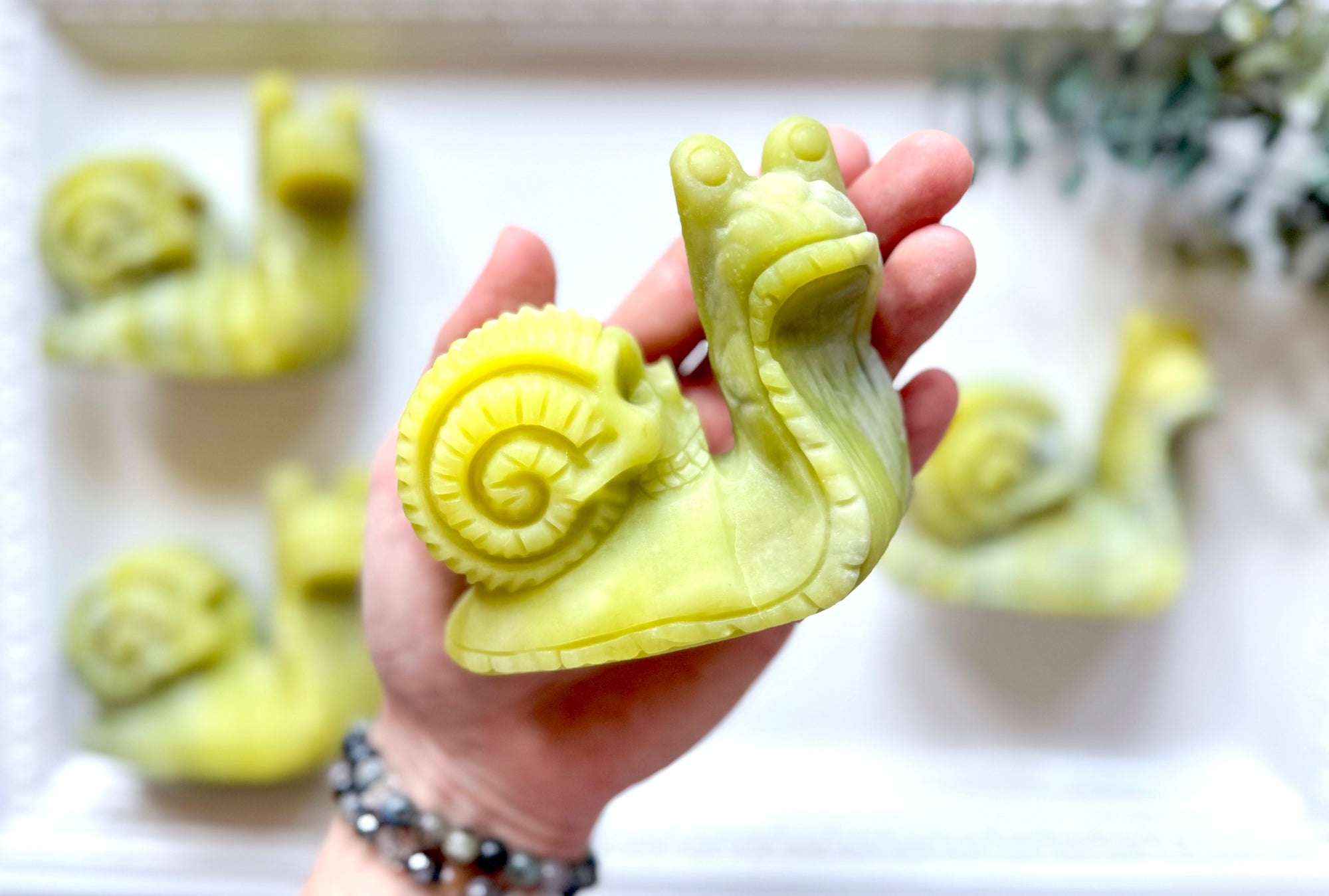 Xiuyan Jade Snail with Skull Shell Carving