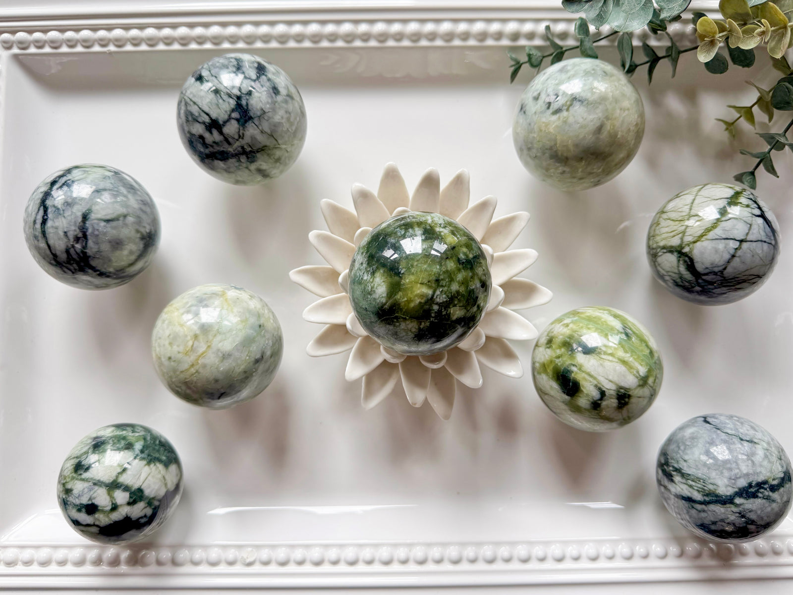 light green Xiuyan jade sphere