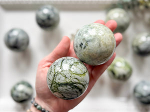 light green Xiuyan jade sphere