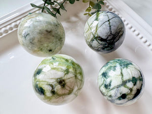 light green Xiuyan jade sphere