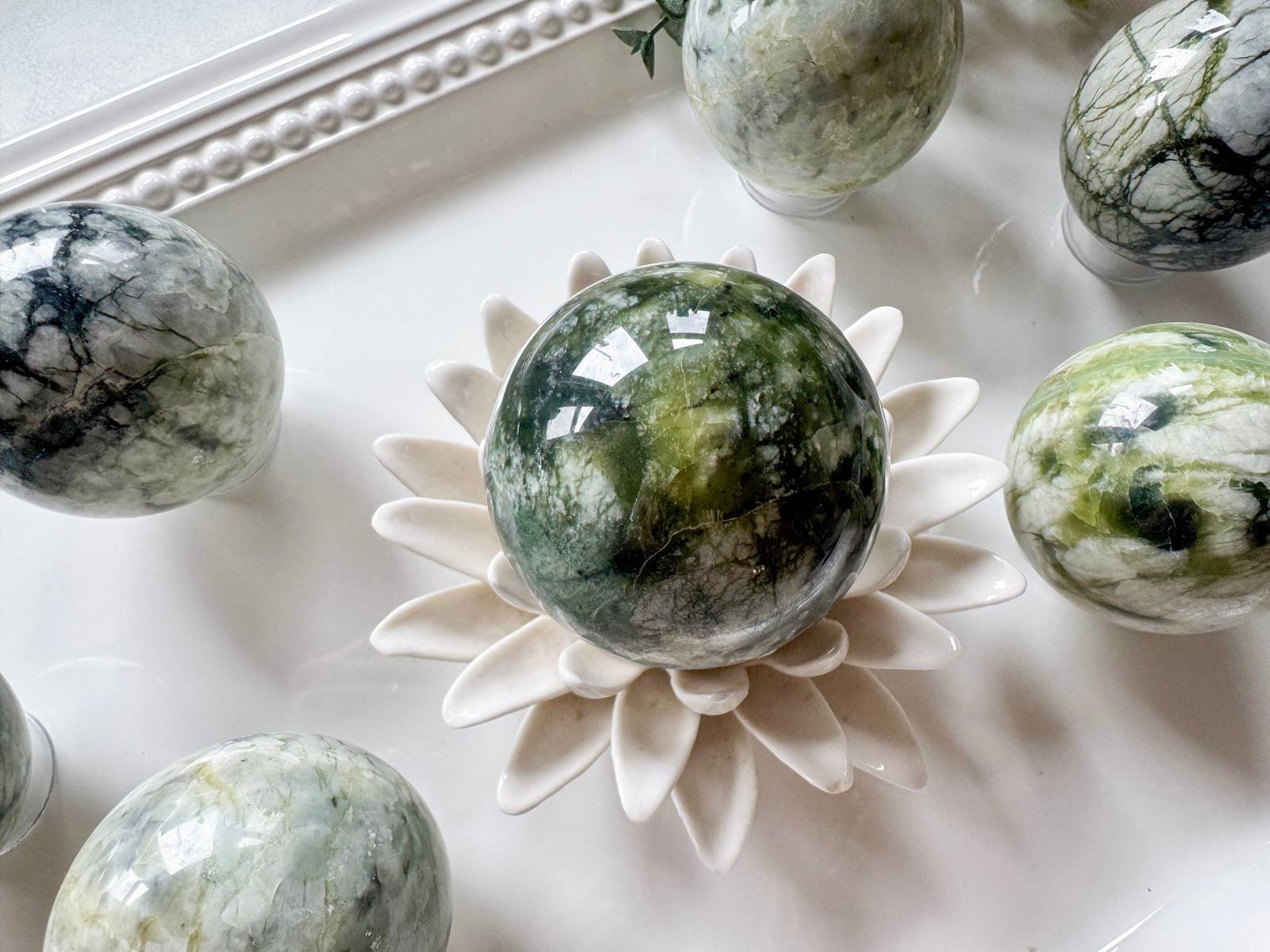 light green Xiuyan jade sphere